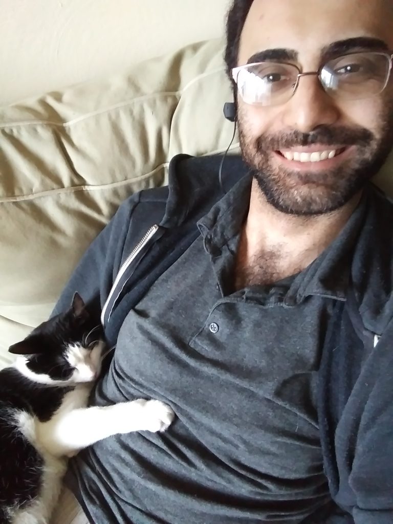Shahin Kaveh with his cat Dio